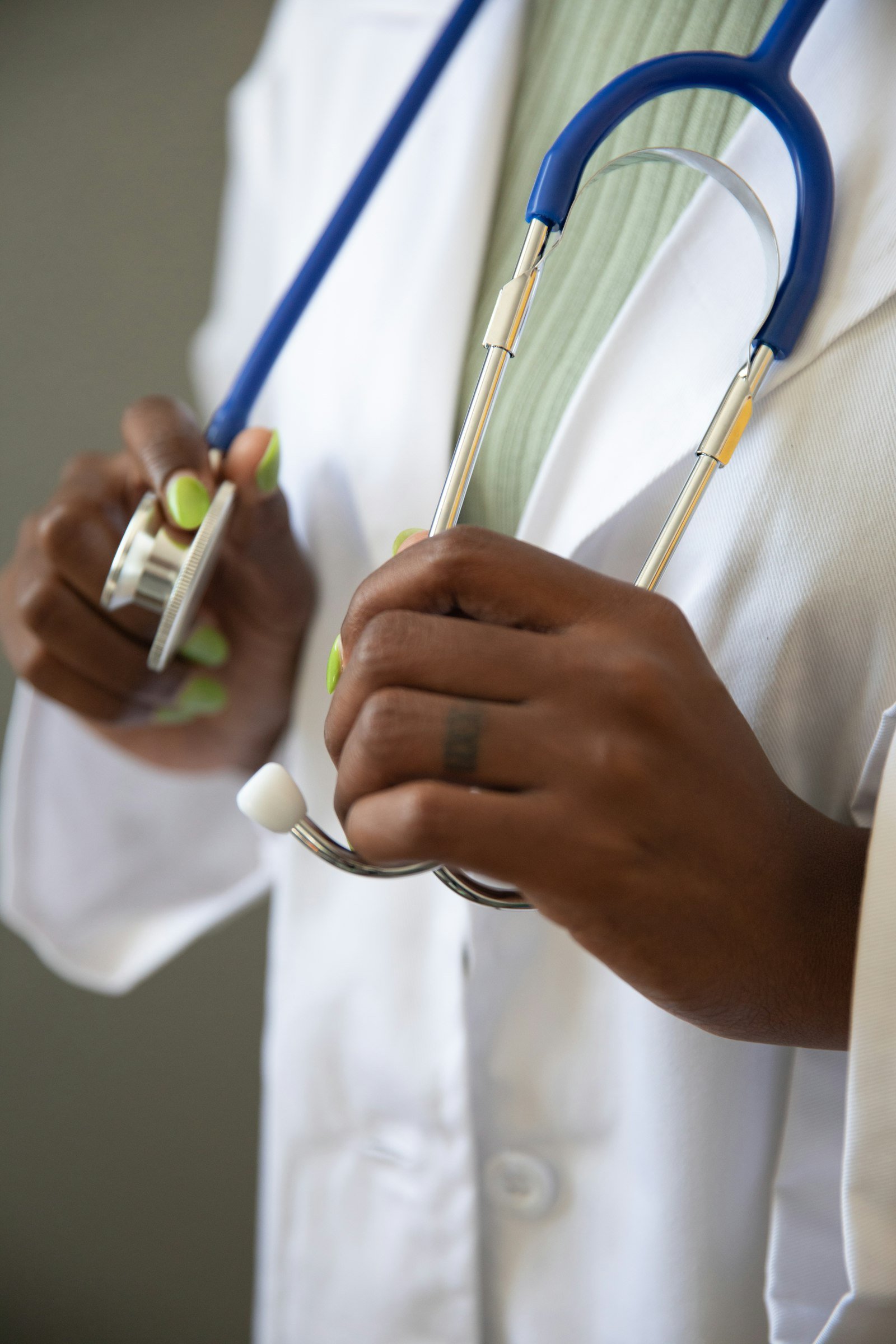 Cardiologist holding a stethoscope before a consultation